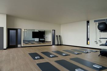 Bi-level fitness center with weights, cardio equipment, fitness on demand, trx and more